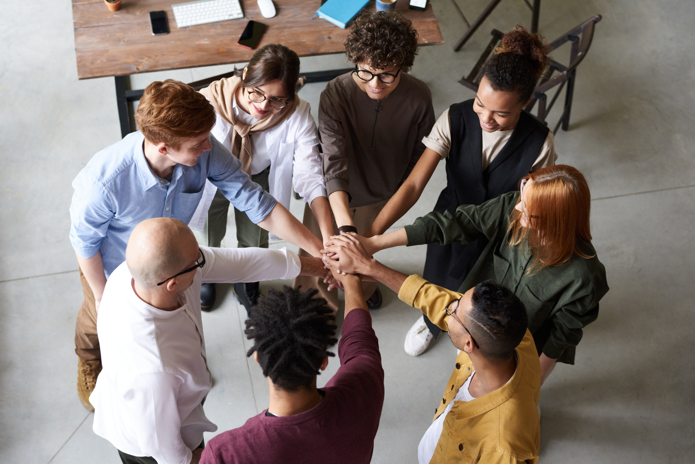 Photo Of People Holding Each Other's Hands